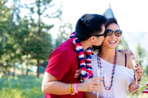Man Kissing Smiling Woman On The Cheek, 4th of july photo